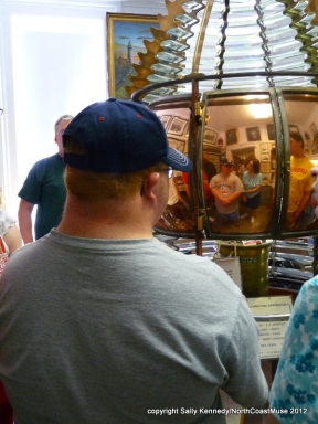 Andy reflected in the Fresnel lens, Fairport Harbor Lighthouse Museum, Fairport Harbor, Ohio